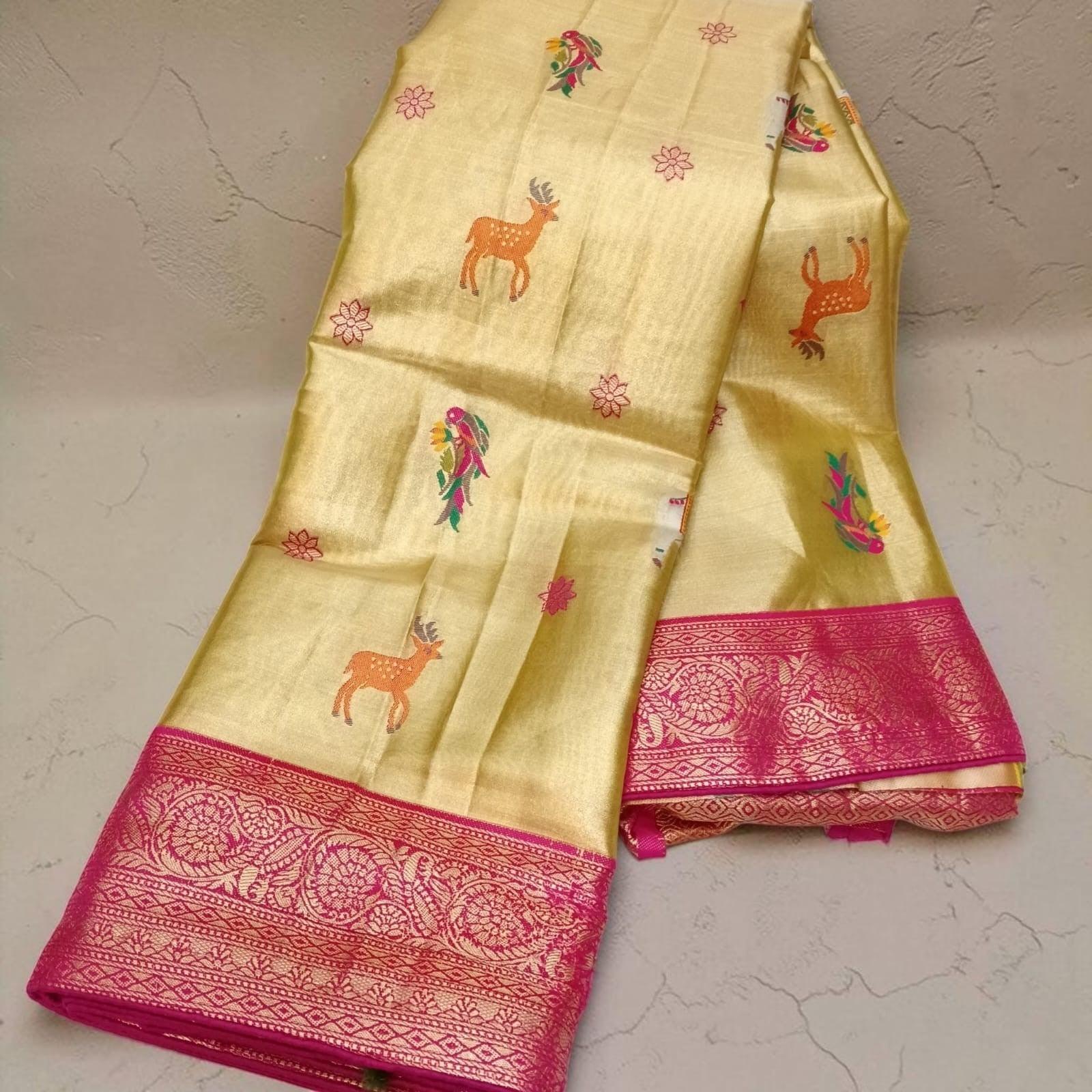 City Center Sankalp tissue saree in gold with pink floral border and deer motifs, includes matching blouse piece.
