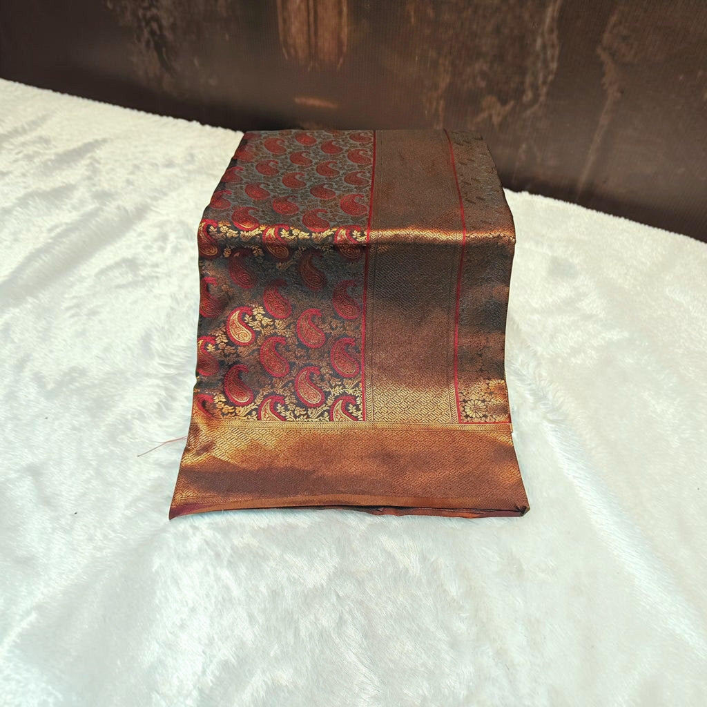 City Center satin silk saree featuring a deep red and gold paisley pattern with a rich metallic border.