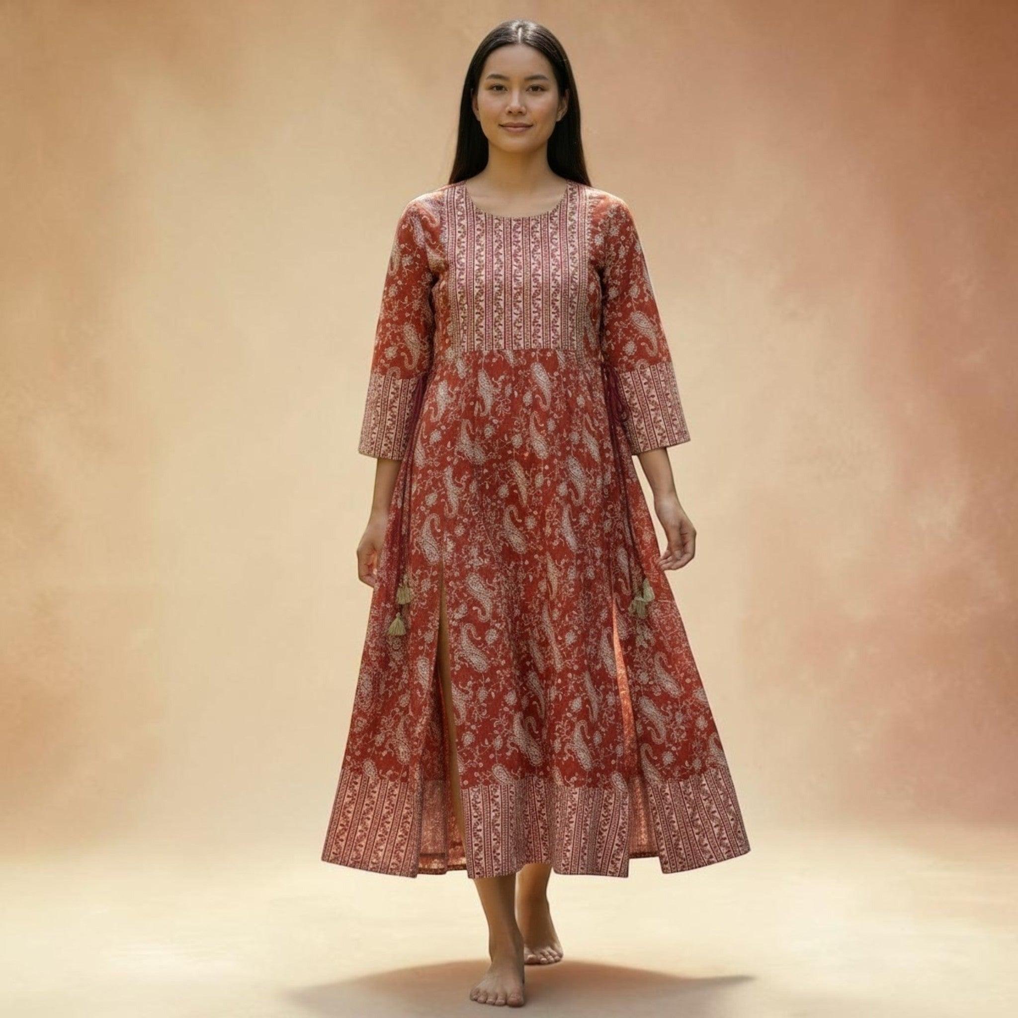 City Center Simra Anarkali Kurti in rust red with white paisley print, featuring a flared silhouette and side slits.