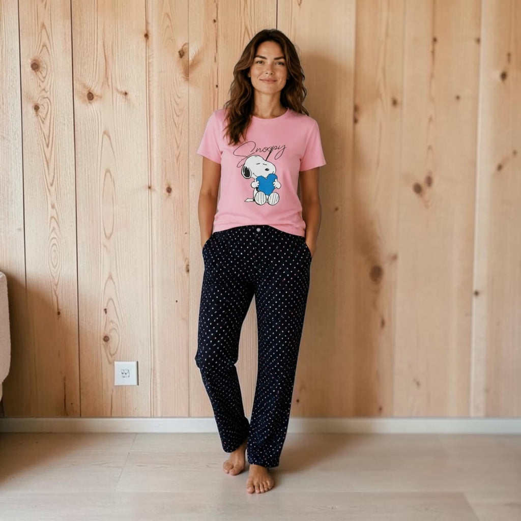 City Center co-ord set featuring a pink Snoopy graphic t-shirt and navy blue polka dot lounge pants on a woman
