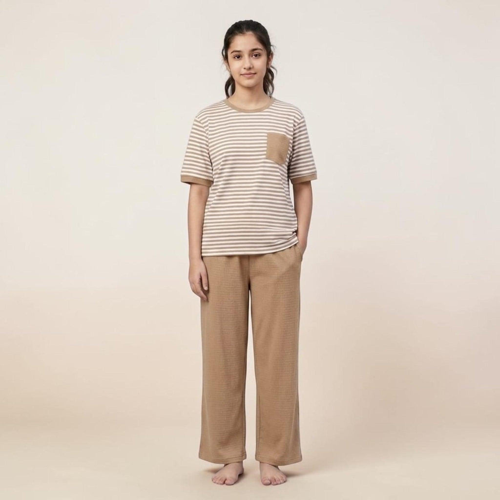 City Center women's airport co-ord set featuring a striped t-shirt with pocket and solid beige wide-leg trousers.