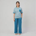 City Center women's airport co-ord set with a striped t-shirt and solid blue wide-leg trousers.