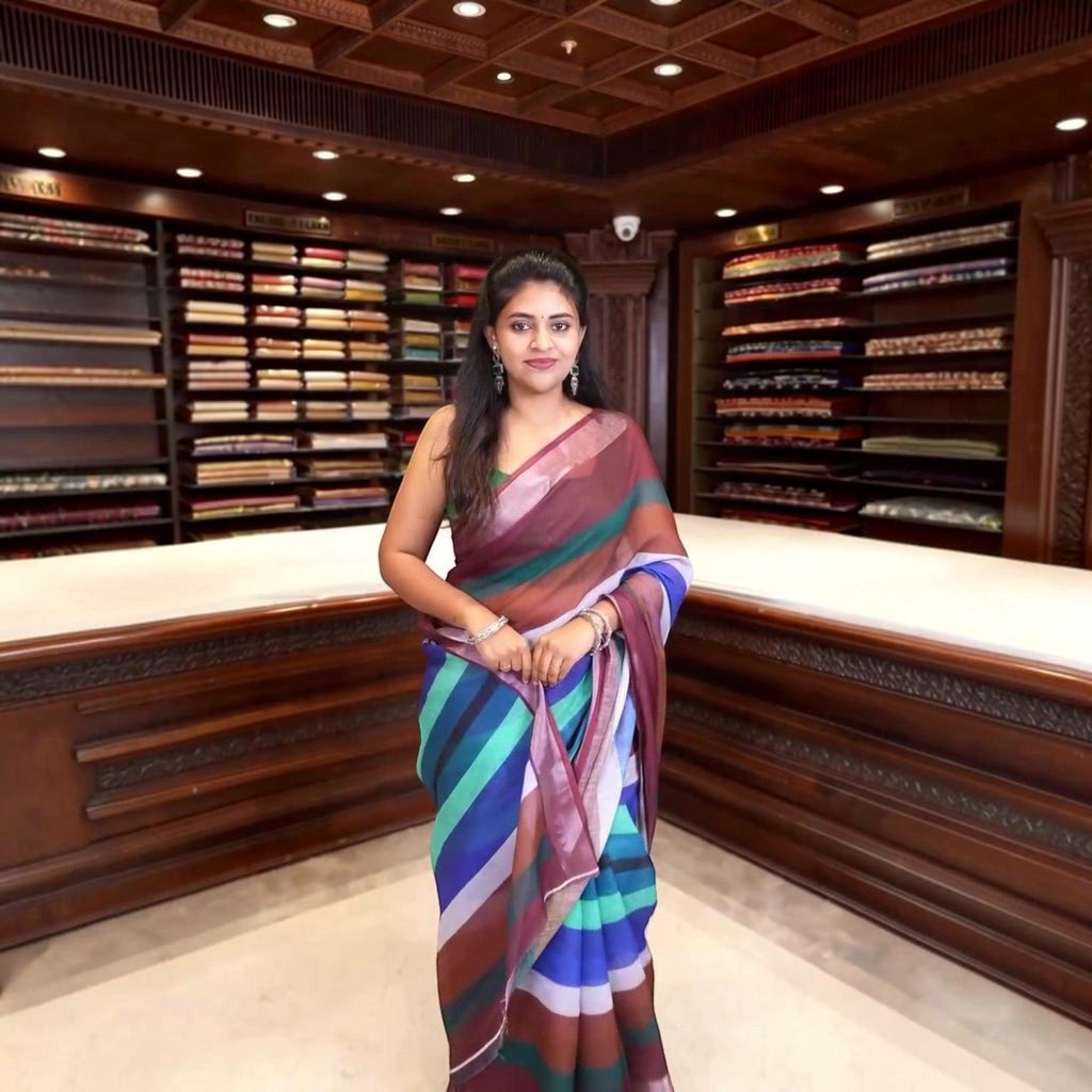 City Center premium cotton saree featuring vibrant diagonal stripes in maroon, blue, and teal worn by a woman.