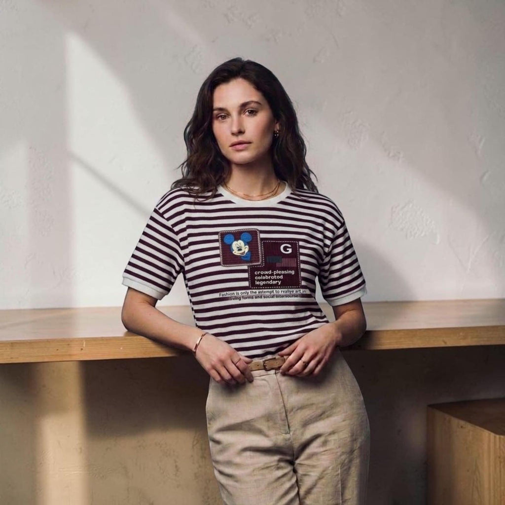 City Center premium cotton t-shirt with brown and white stripes and a graphic print worn by a woman