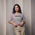 City Center striped cotton t-shirt with Explorer floral graphic print worn by a woman with beige trousers
