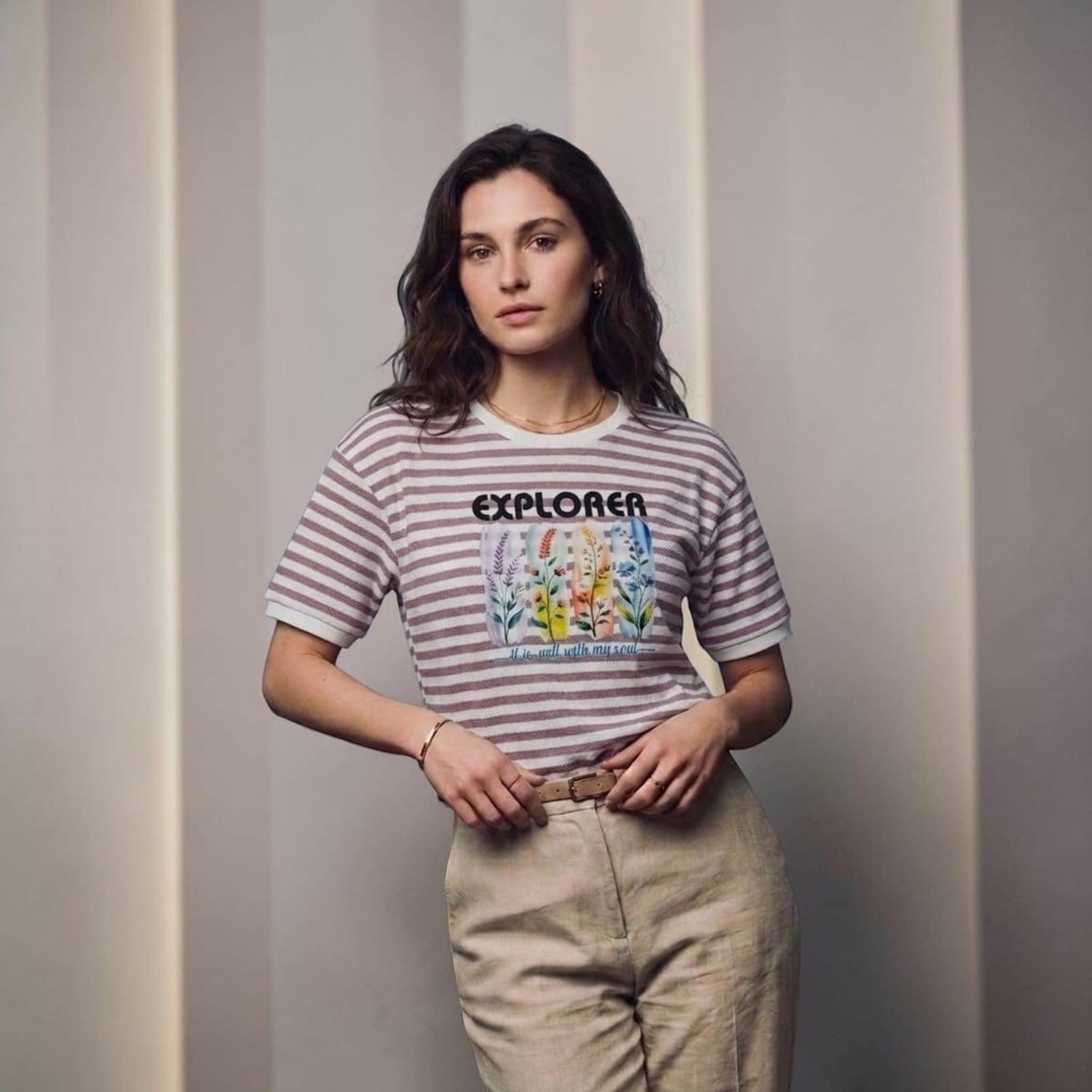 City Center striped cotton t-shirt with Explorer floral graphic print worn by a woman with beige trousers