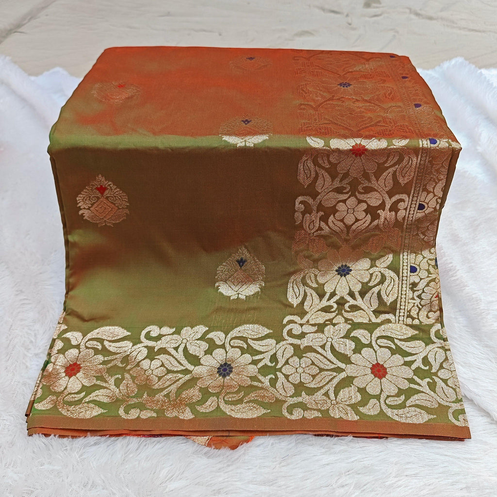 City Center Takshashila silk blend saree in olive green and rust orange with intricate floral mina jari weaving