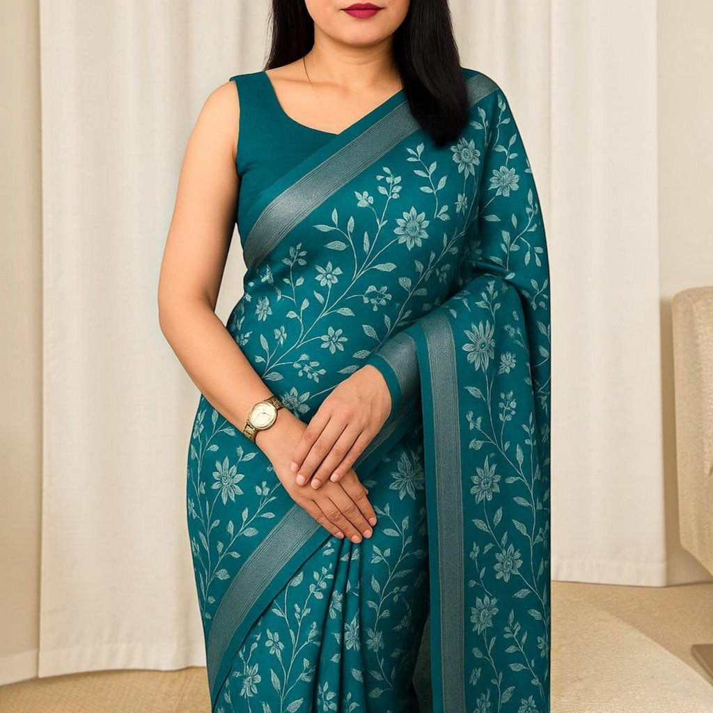 City Center premium teal cotton saree with delicate silver floral embroidery and a matching sleeveless blouse
