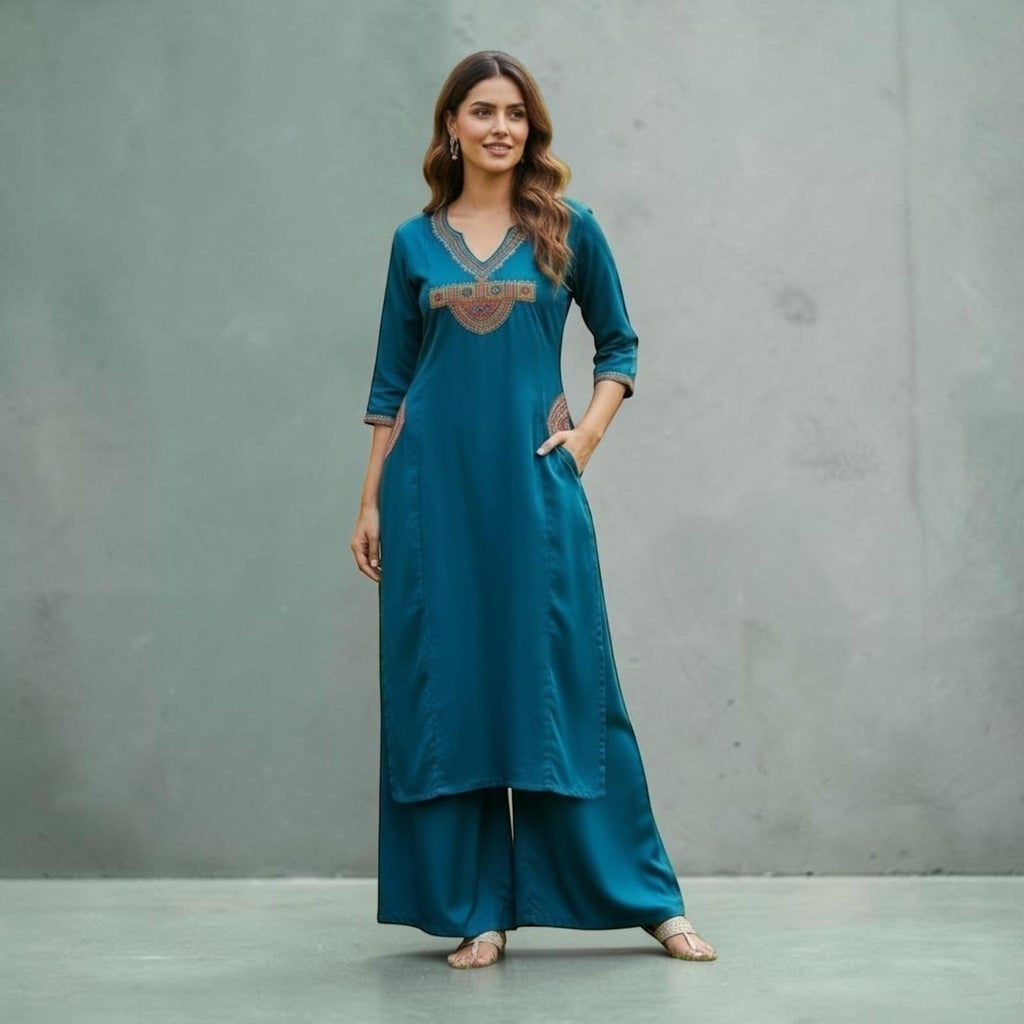 City Center teal kurta and pant set with V-neckline, intricate ethnic embroidery, and three-quarter sleeves.