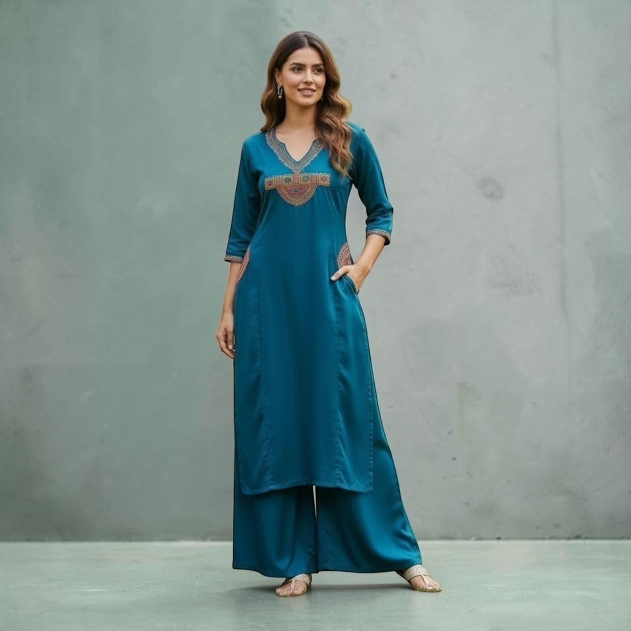 City Center teal kurta and pant set with V-neckline, intricate ethnic embroidery, and three-quarter sleeves.