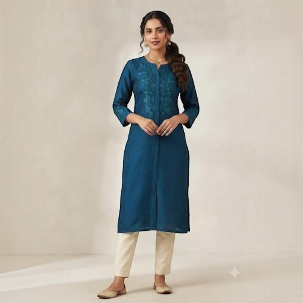 City Center teal straight kurti with delicate embroidery paired with cream trousers on a woman