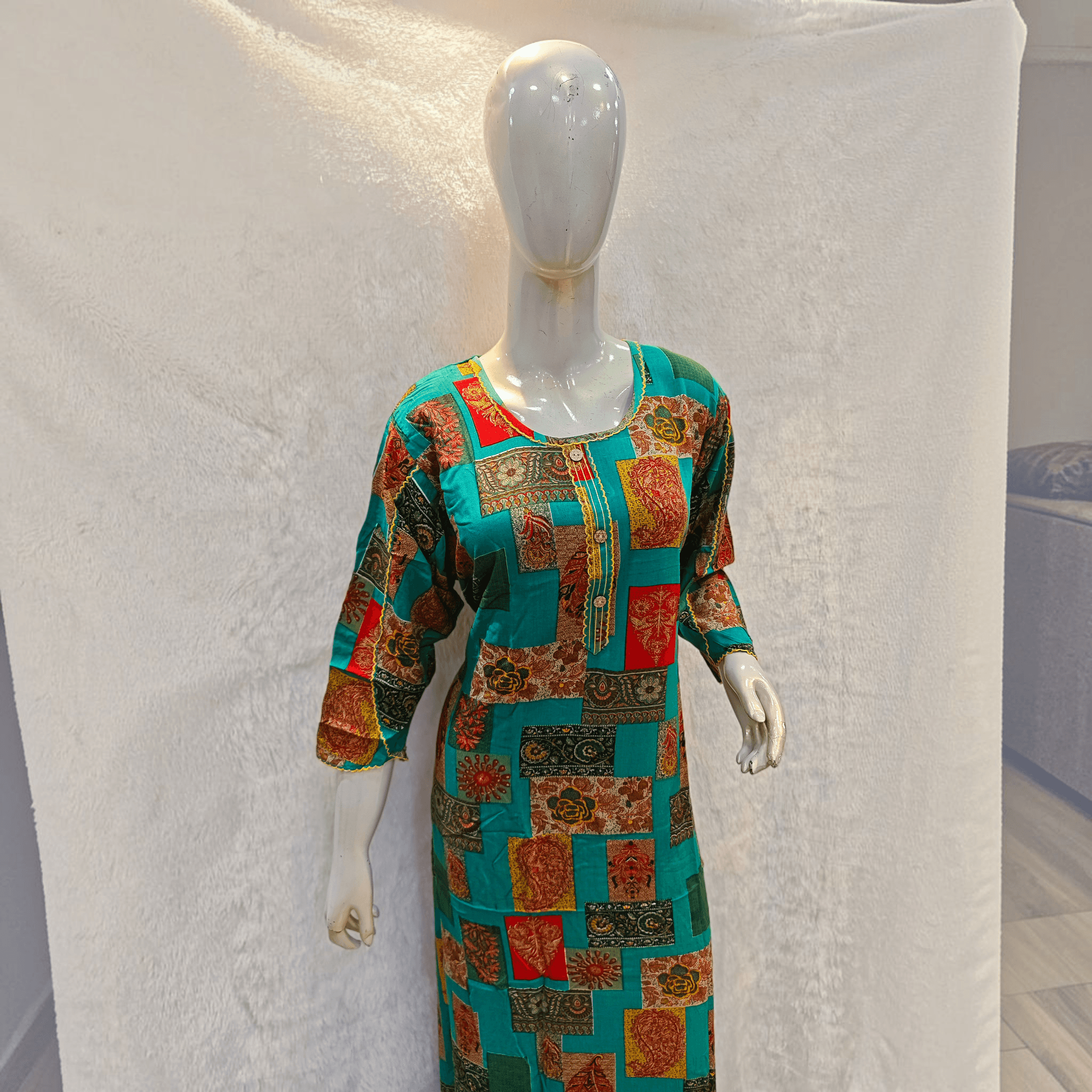 City Center heavy rayon A-line gown featuring a vibrant teal patchwork print with red and gold floral patterns