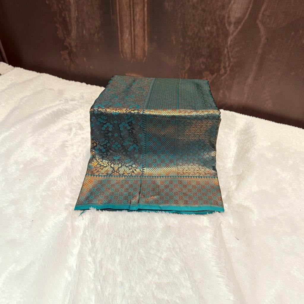 City Center teal satin silk saree with intricate gold zari woven floral and geometric patterns on a soft glossy fabric