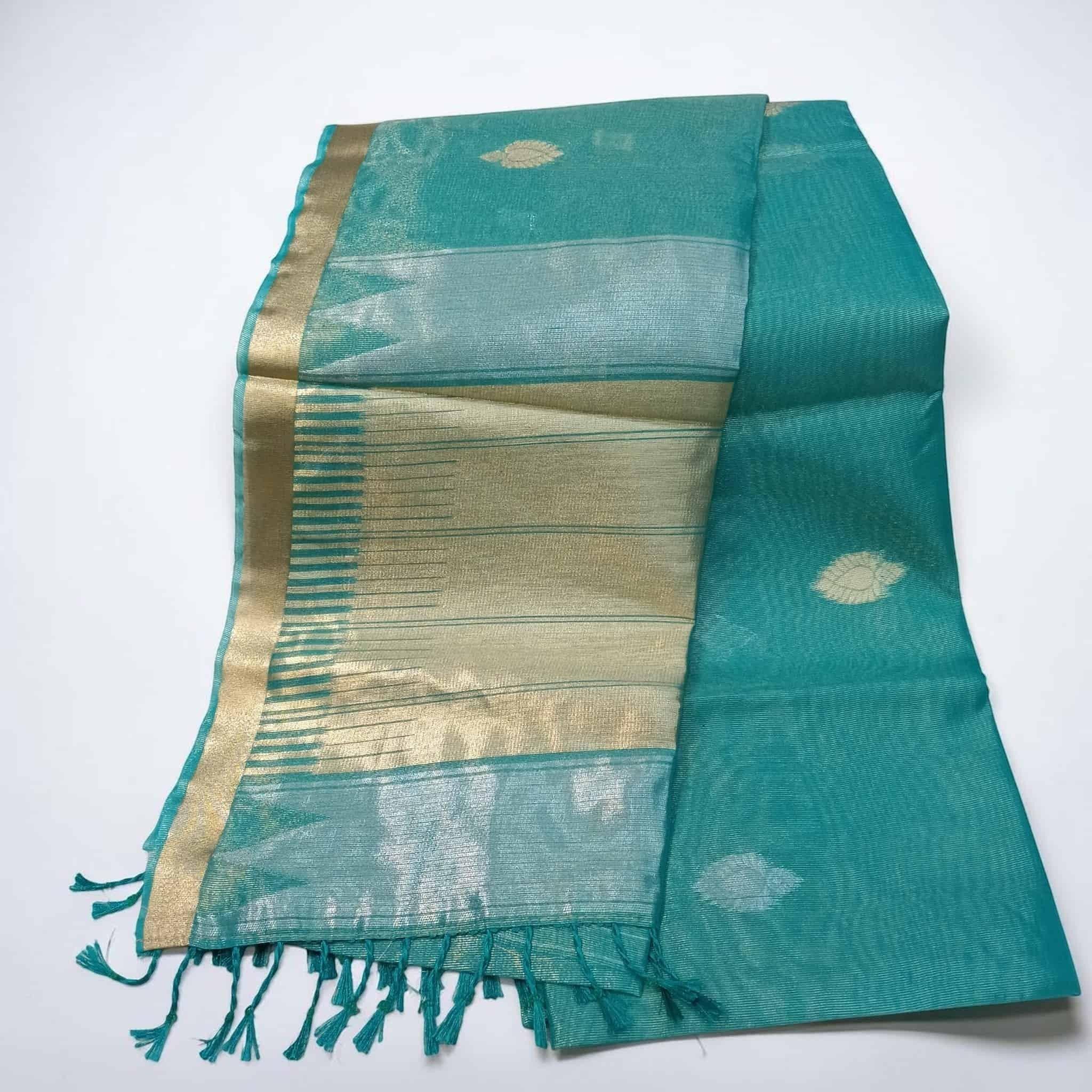 City Center teal tissue cotton saree with gold zari border and delicate leaf motifs, featuring a soft sheen.