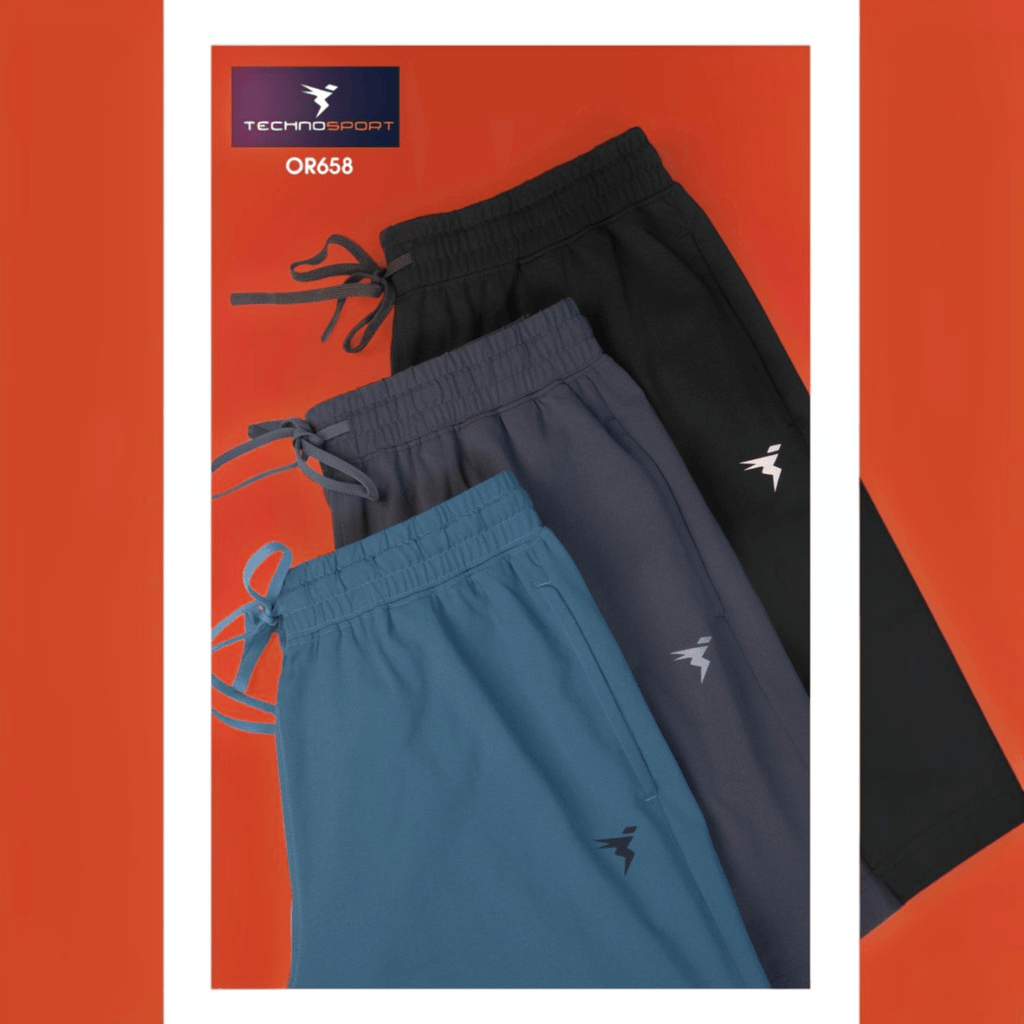 City Center Technosport 4-way stretch athletic shorts in black, charcoal, and blue with drawstring waistbands.