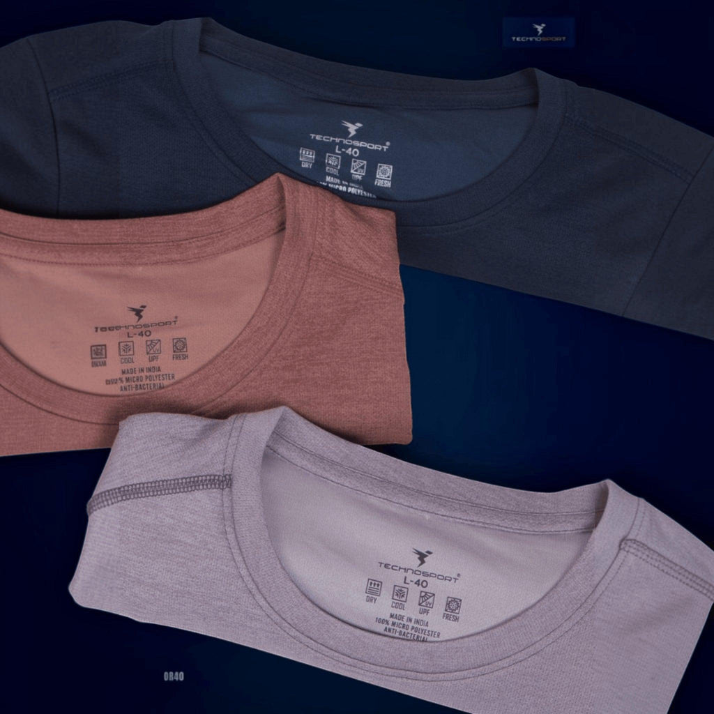 City Center Technosport crew neck athletic t-shirts in navy, dusty rose, and light grey with moisture-wicking fabric.