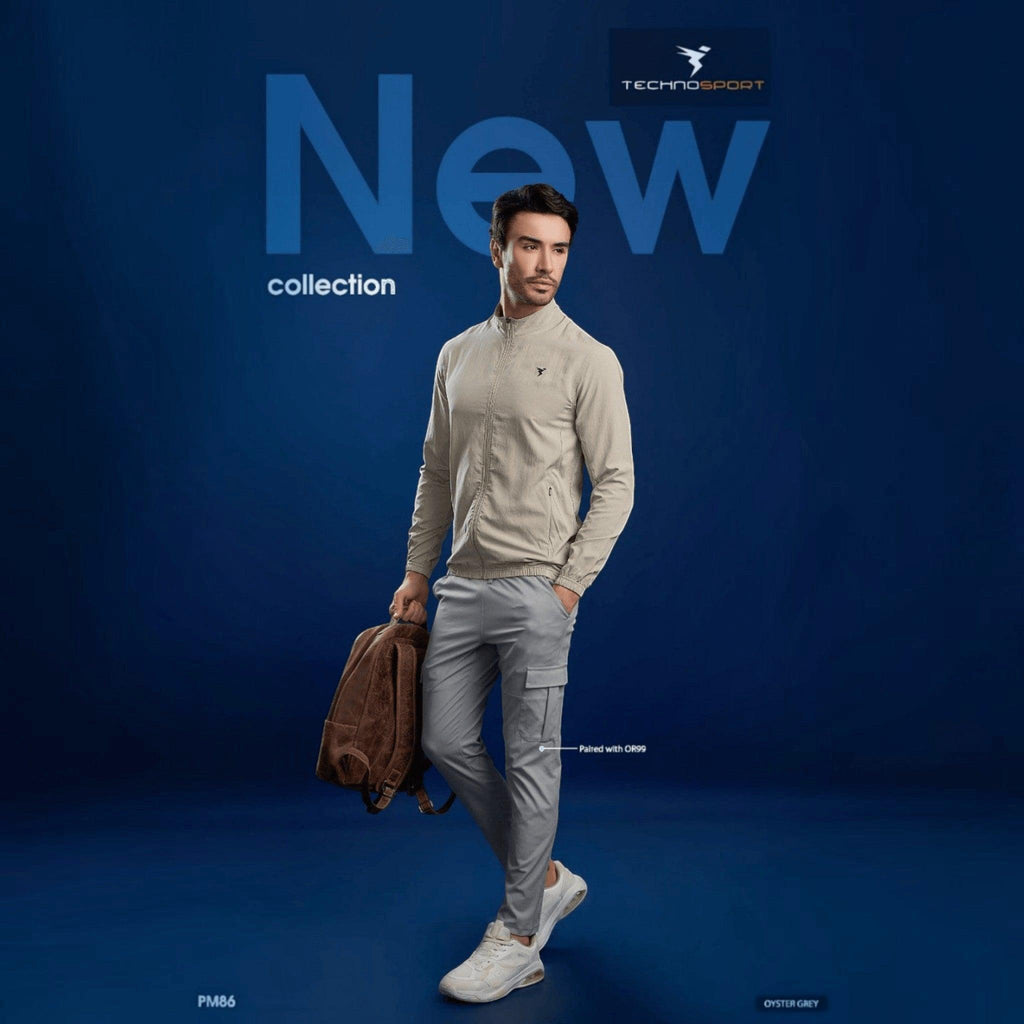City Center model wearing a beige Technosport slim-fit hi-neck jacket with moisture-wicking fabric and front zipper.