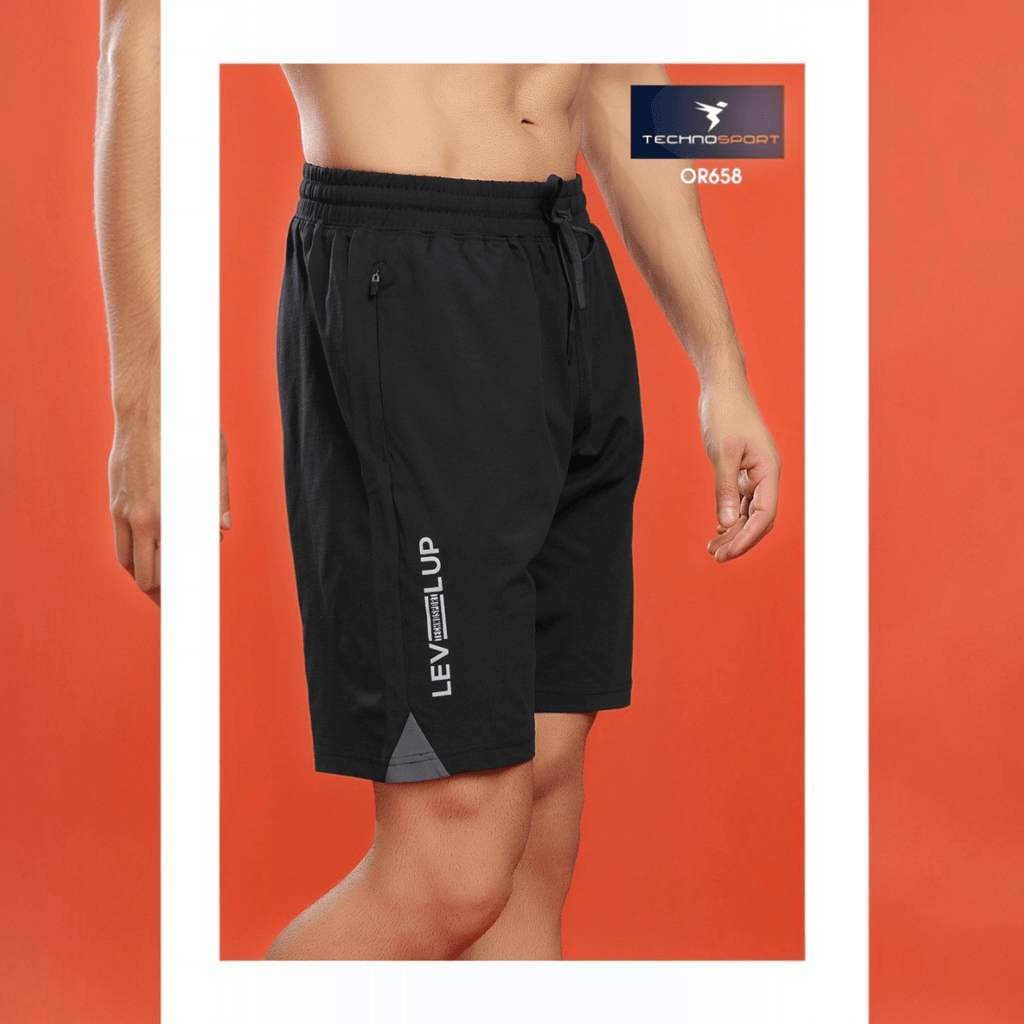 City Center Technosport black 4-way stretch activewear shorts with side graphic detail on an orange background
