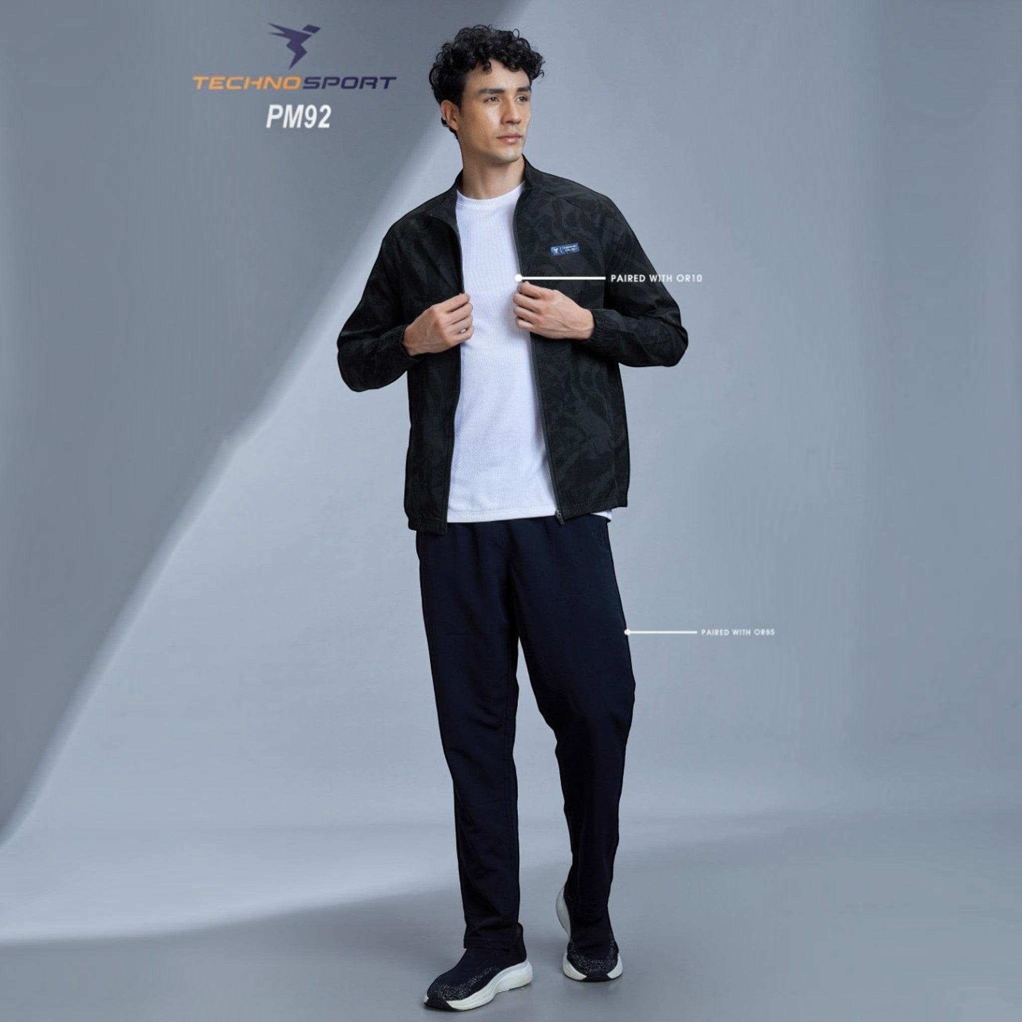 City Center Technosport full-sleeve black hi-neck jacket with all-over print worn by a male model