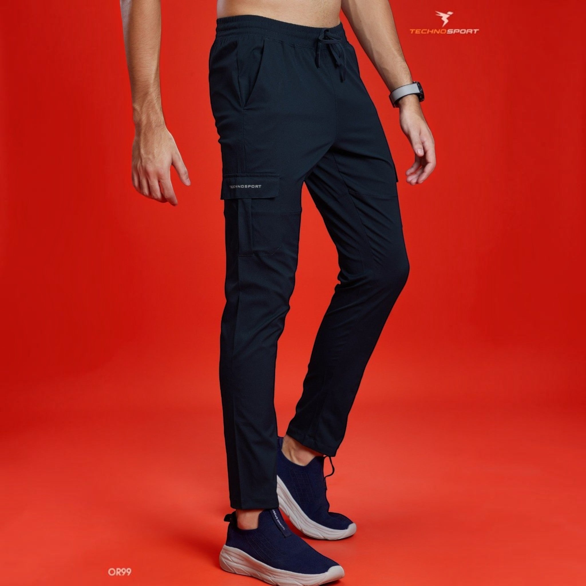 City Center Technosport TS Flexi solid black woven cargo pants with side pockets on a model against a red background