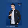 City Center model wearing a black Technosport TS Flexi PM86 performance jacket with a white t-shirt on a blue background