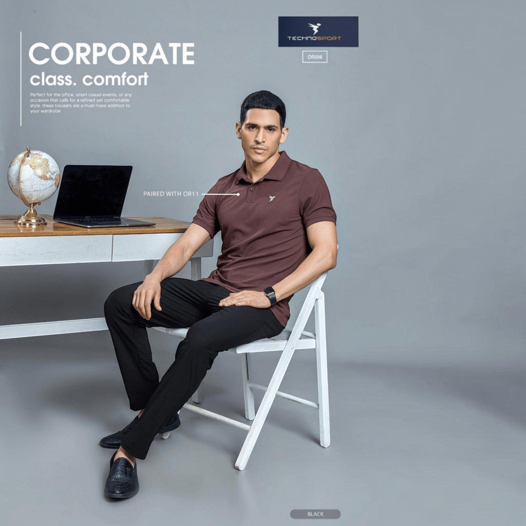 City Center Technosport black DuraCool+ formal pants worn by a man in a brown polo shirt in an office setting