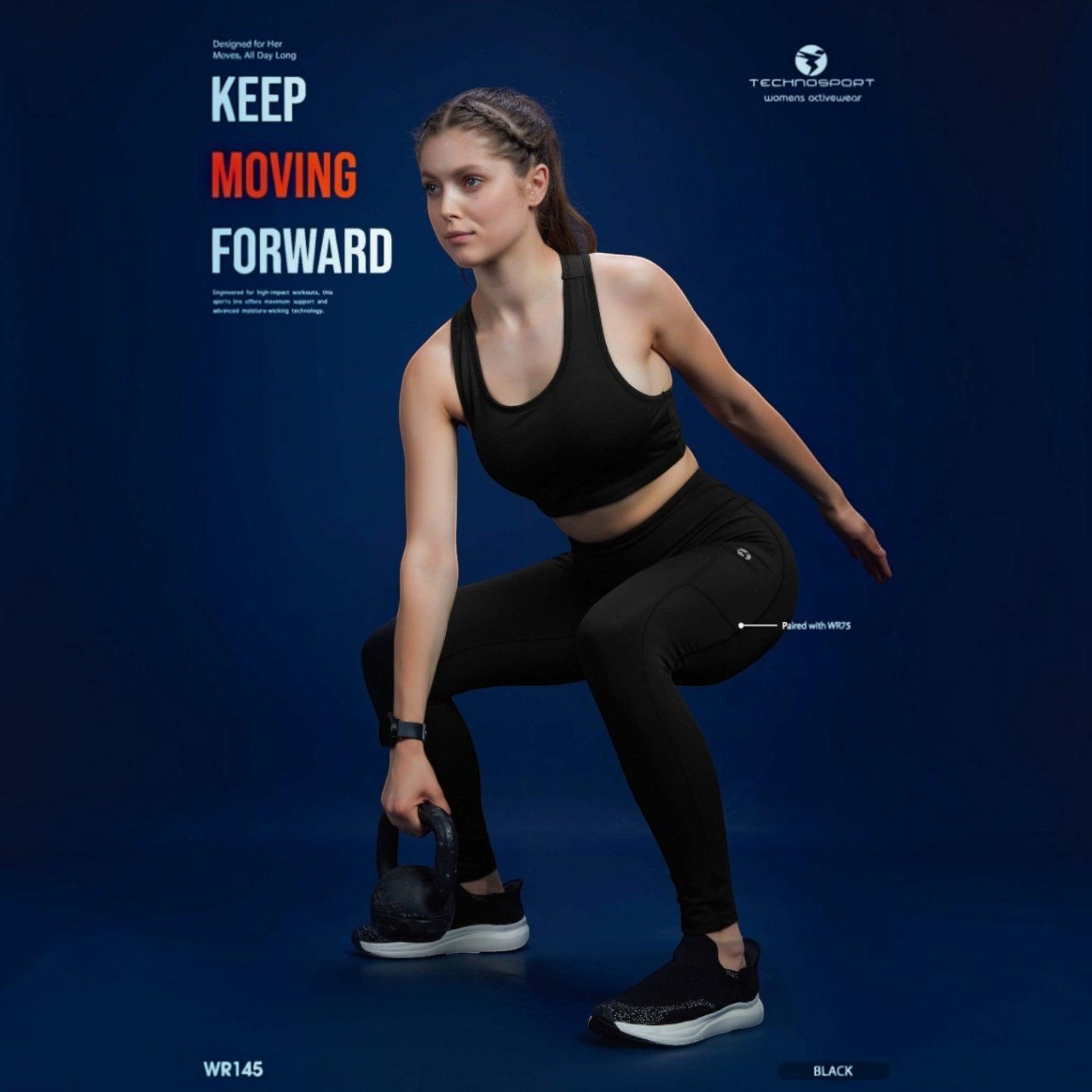 City Center Technosport Elastoplus black racer back sports bra worn by a woman performing a kettlebell squat