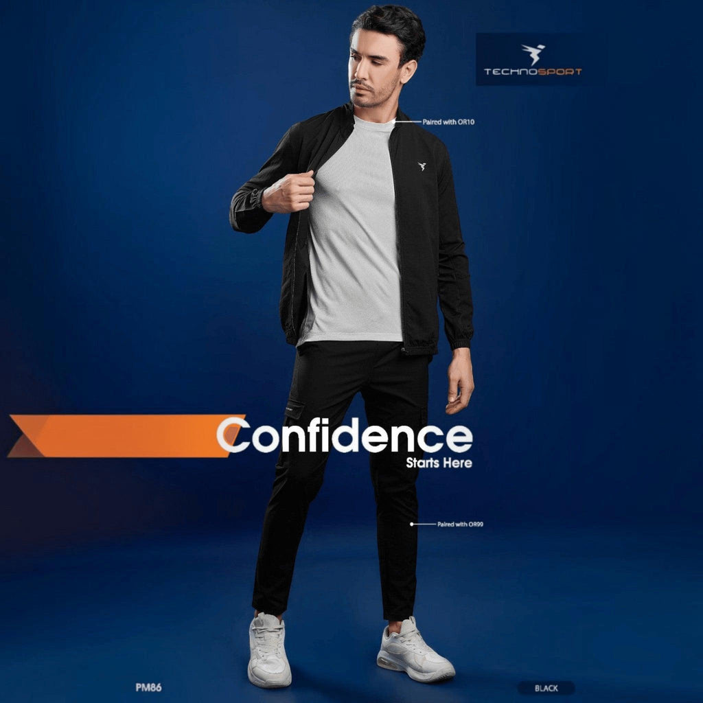 City Center Technosport black slim-fit hi-neck jacket worn by a model over a white t-shirt against a blue background.