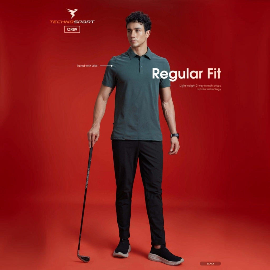 City Center Technosport black 4-way stretch track pants worn by a model against a red background