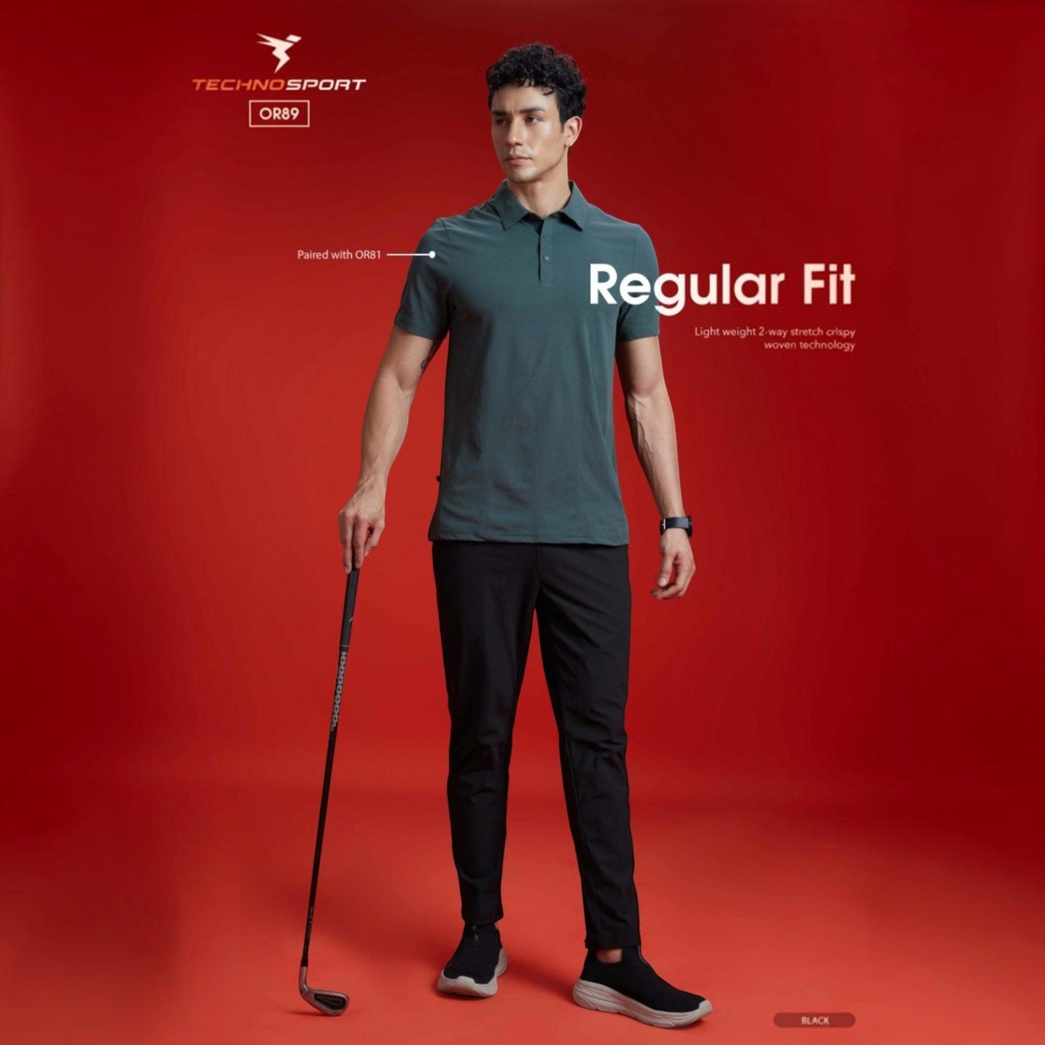 City Center Technosport black 4-way stretch track pants worn by a model against a red background