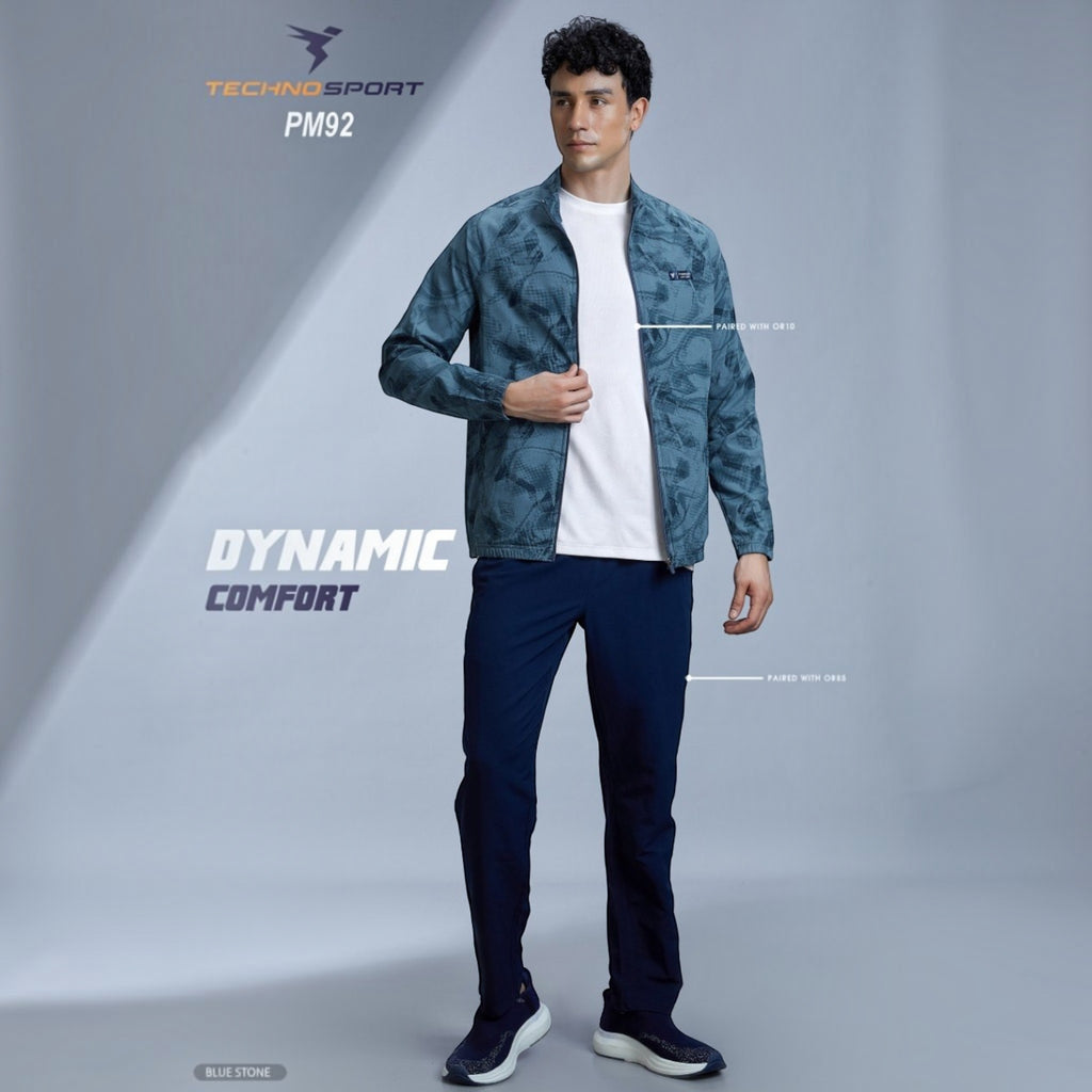 City Center Technosport blue all-over print high-neck jacket worn by a male model with navy trousers