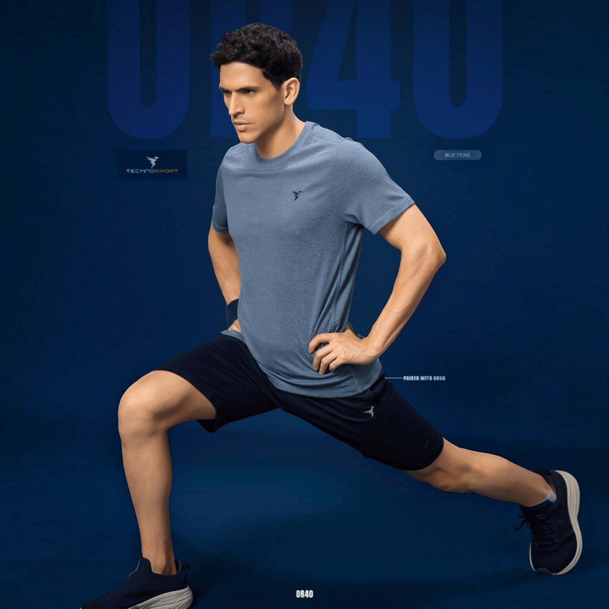 City Center Technosport blue stone athletic crew neck t-shirt with moisture-wicking performance fabric on a model