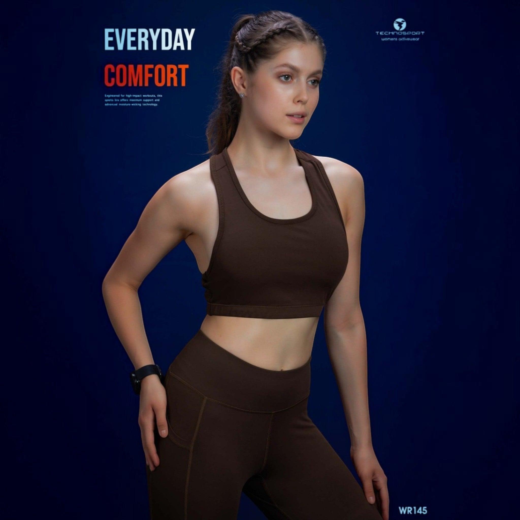 City Center model wearing a brown Technosport Elastoplus racer back sports bra against a dark blue background