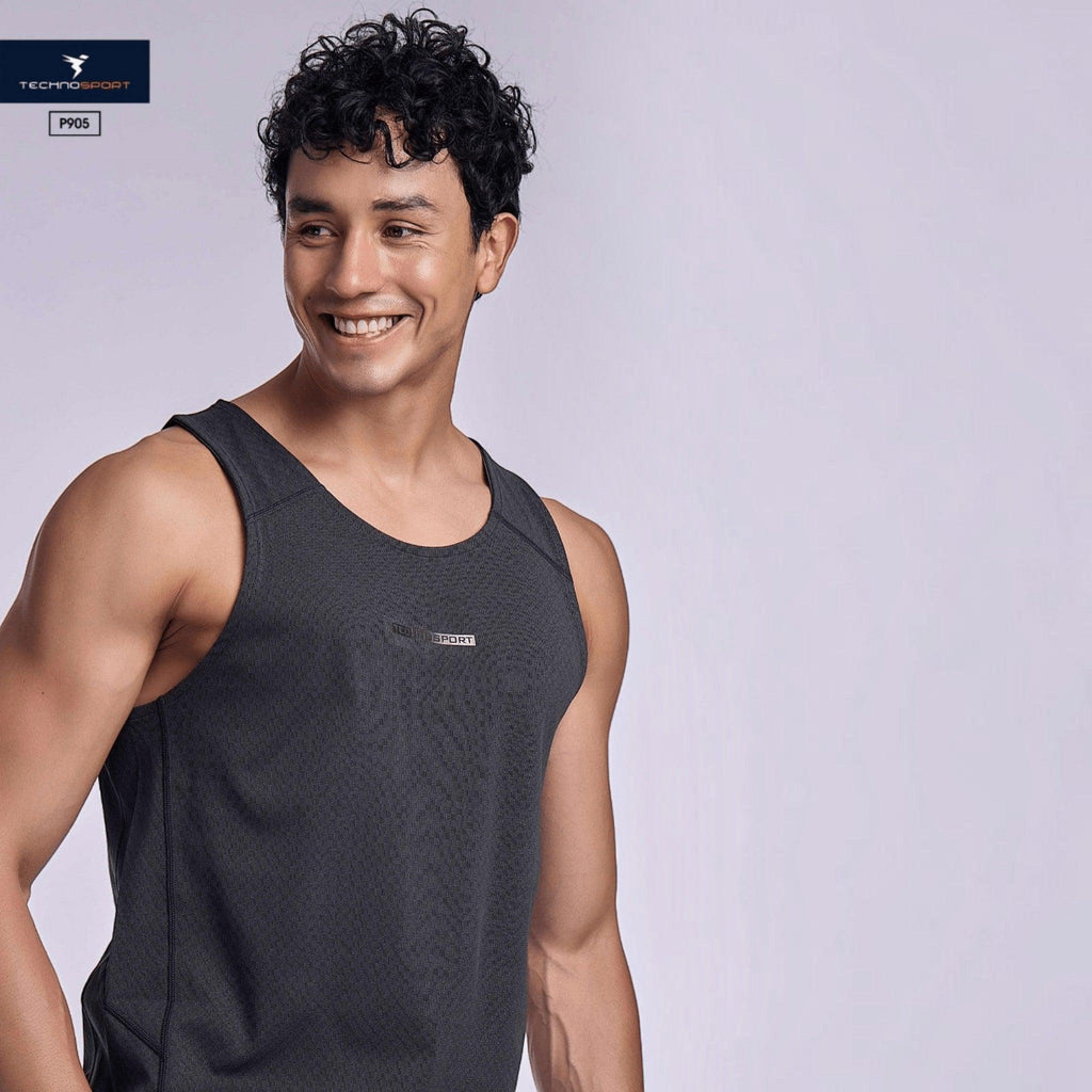 City Center TECHNOSPORT Millenova sleeveless athletic tank top in charcoal grey worn by a smiling male model