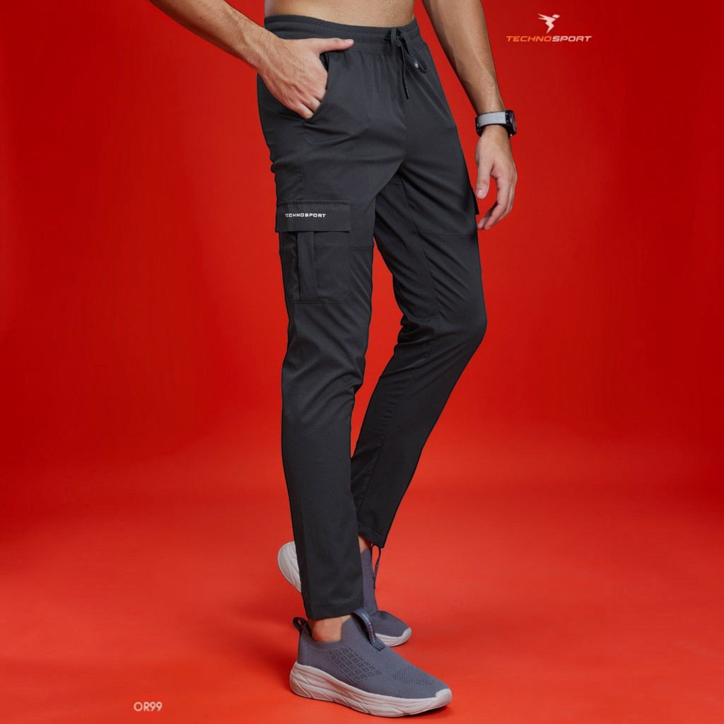 City Center Technosport TS Flexi solid woven charcoal grey cargo pants with side pockets on a model against red