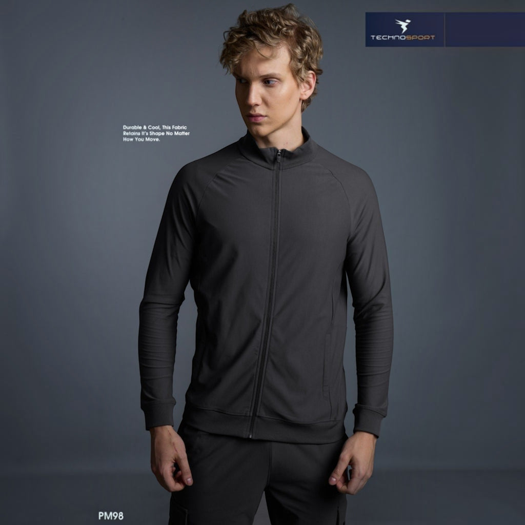 City Center model wearing a charcoal grey Technosport DuraCool+ high-neck zip-up jacket with moisture-wicking fabric.