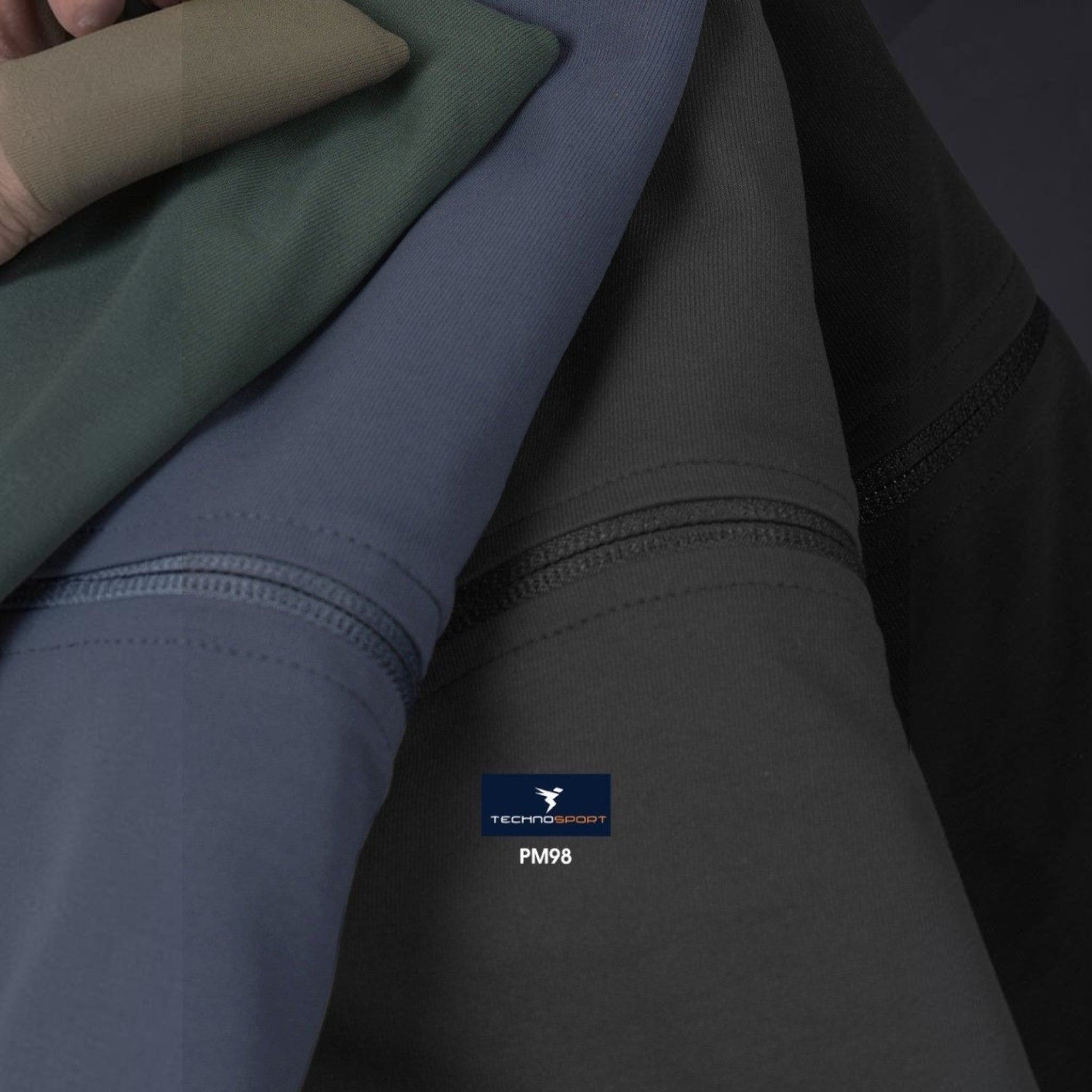 City Center Technosport DuraCool+ moisture-wicking fabric swatches in olive, blue, charcoal, and black.