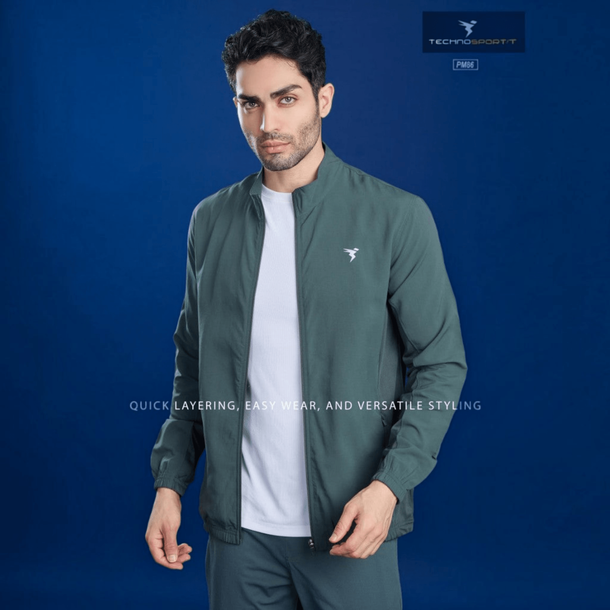 City Center model wearing a green Technosport TS Flexi performance jacket with 2-way stretch and moisture-wicking fabric