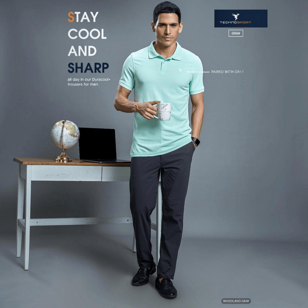 City Center Technosport DuraCool+ charcoal gray formal trousers worn by a man with a light green polo shirt.