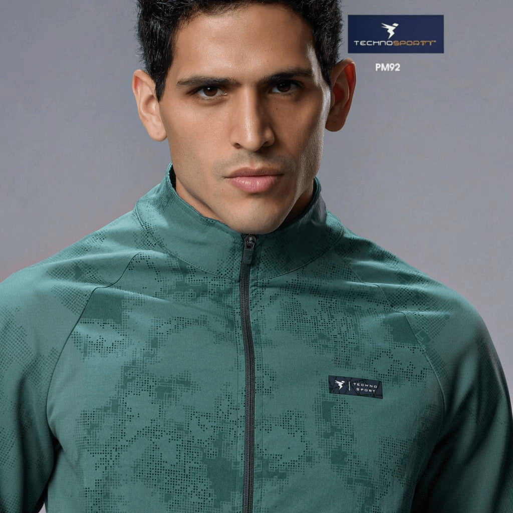 City Center Technosport men's green hi-neck athletic jacket with AOP pattern, front zipper, and moisture-wicking fabric