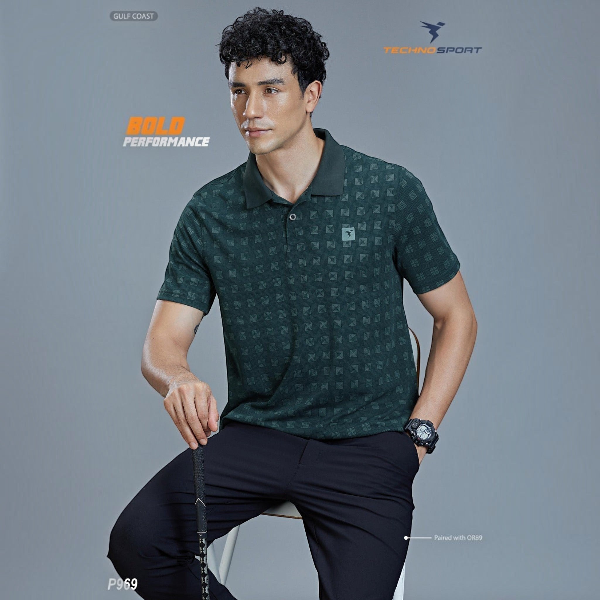 City Center model wearing a dark green patterned Technosport P969 performance polo shirt with a button placket.