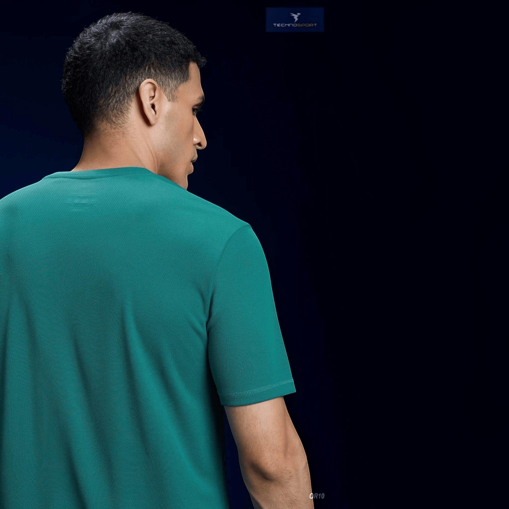 City Center Technosport green crew neck slim fit performance t-shirt worn by a man from the back view