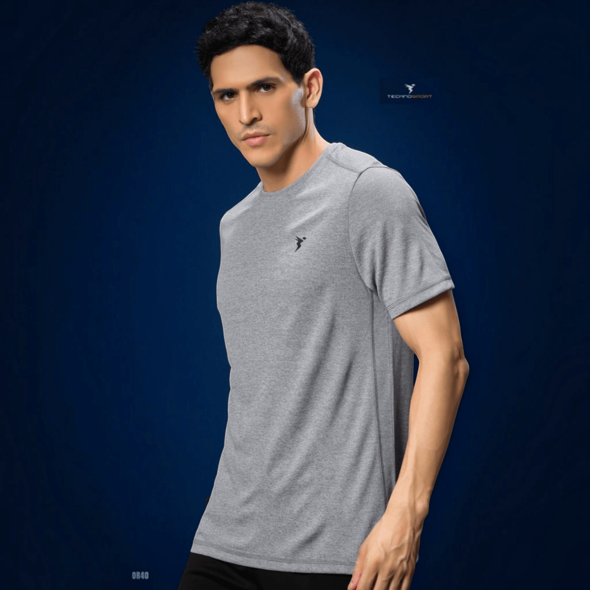 City Center Technosport grey athletic crew neck t-shirt with moisture-wicking performance fabric on a male model