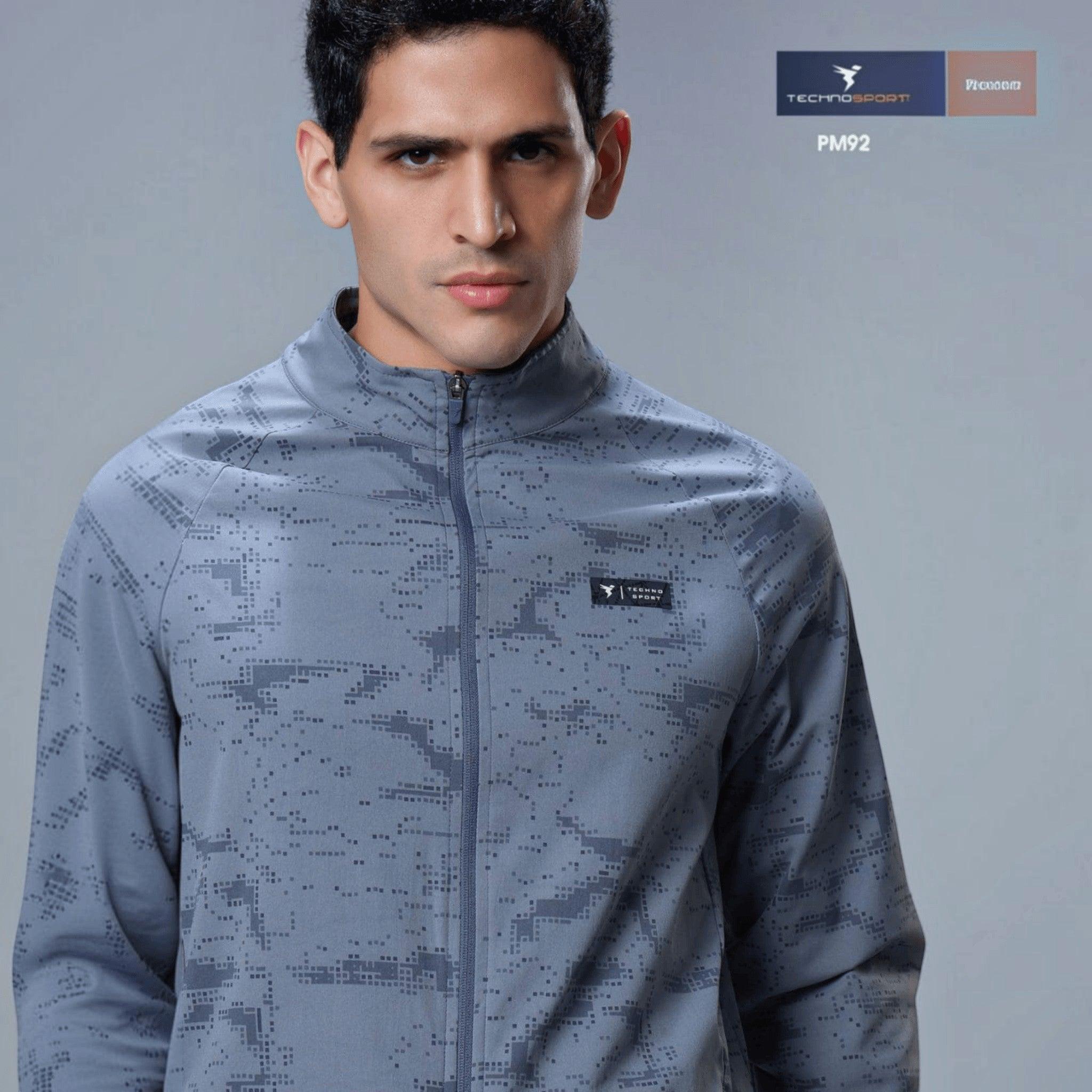 City Center Technosport men's grey hi-neck jacket with a digital camo print, full zipper, and moisture-wicking fabric.