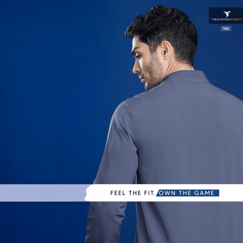 City Center Technosport TS Flexi grey performance jacket worn by a man, featuring moisture-wicking stretch fabric.