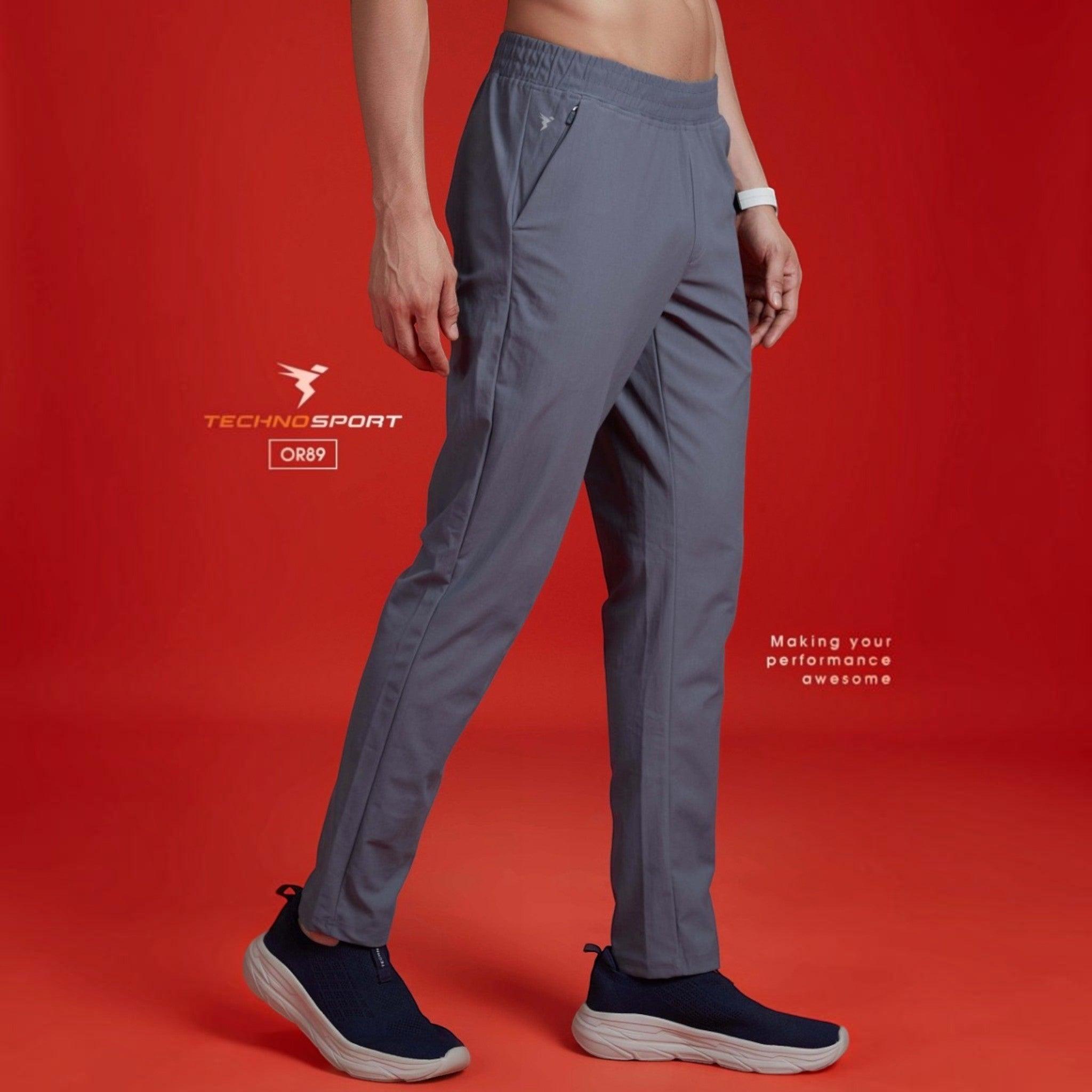 City Center Technosport grey 4-way stretch track pants with moisture-wicking DuraCool+ fabric on a model