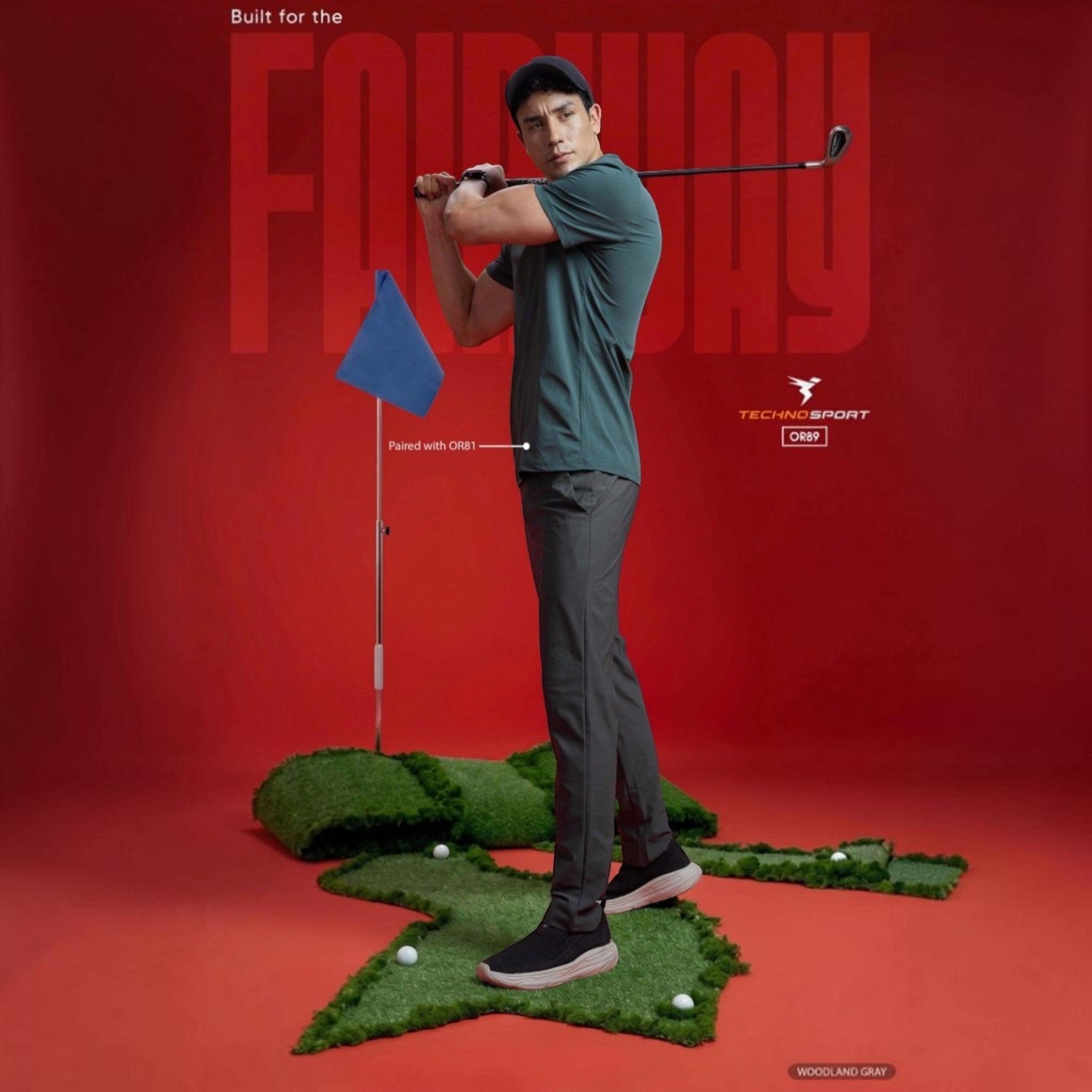 City Center Technosport DuraCool+ solid grey 4-way stretch track pants worn by a golfer on a putting green