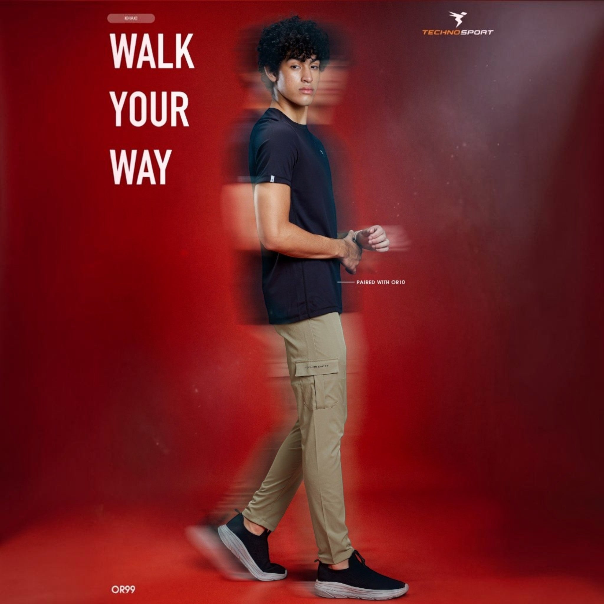 City Center model wearing Technosport TS Flexi khaki woven cargo pants with functional pockets against a red background