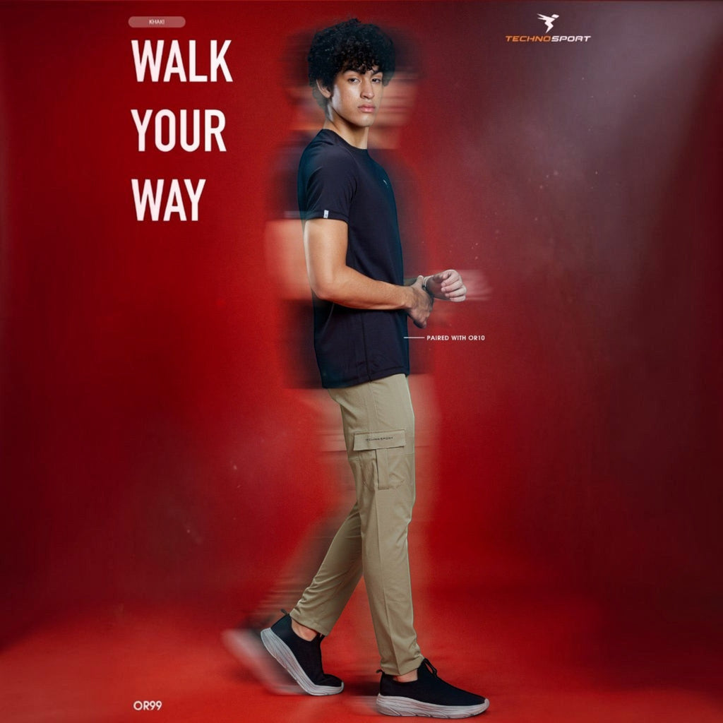 City Center model wearing khaki Technosport TS Flexi woven cargo pants with side pockets and a black t-shirt.