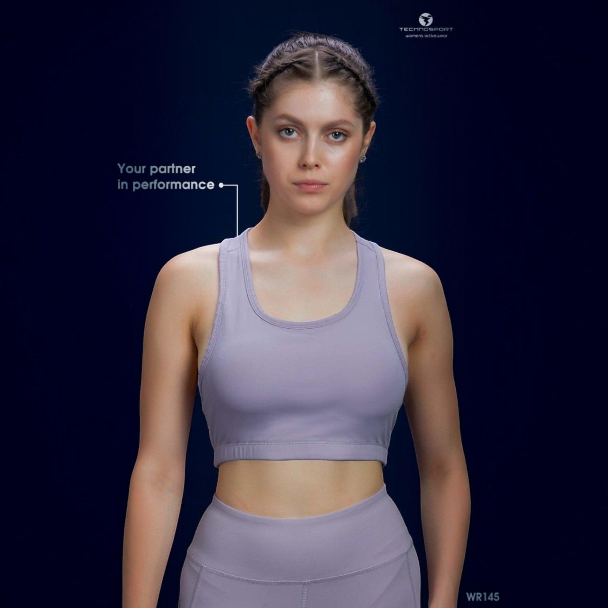 City Center Technosport Elastoplus lavender racer back sports bra worn by a model against a dark blue background